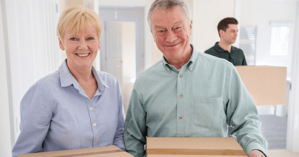 7 Benefits of Downsizing to Senior Living Elder couple with moving boxes