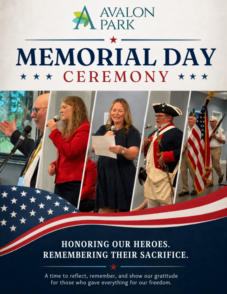 Memorial Day ceremony banner at Avalon Park with people singing and American flags displayed.